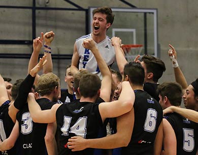 Keyano Huskies libero Alex Sabourin is lifted on his team’s shoulders after the bronze medal winning points at the 2017-2018 Canadian Collegiate Athletic Association (CCAA) Men's Volleyball Championships  (Credit Erwin Kuhr)